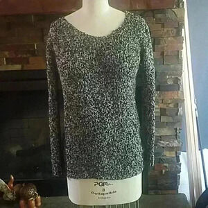 Sweater with bow back cutout.